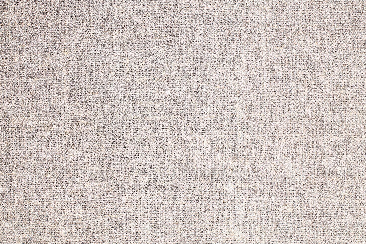 Natural Linen Material Textile Canvas Fabric Texture Background Close-up Detail of Fabric Natural Color Hemp Material Pattern Design Wallpaper. Can be Used as Background or For Graphic Design photo