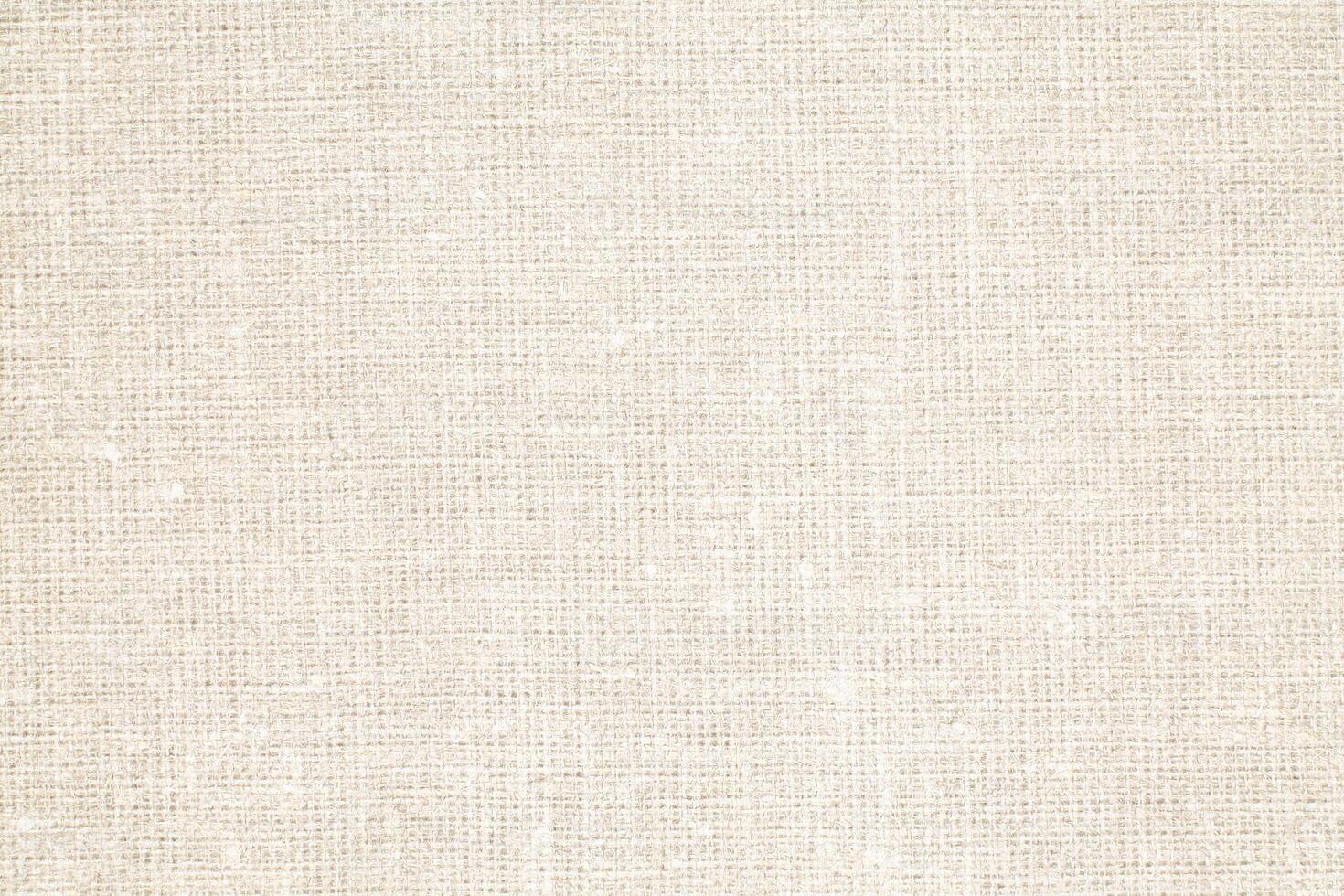 Natural Linen Material Textile Canvas Fabric Texture Background Close-up Detail of Fabric Natural Color Hemp Material Pattern Design Wallpaper. Can be Used as Background or For Graphic Design photo