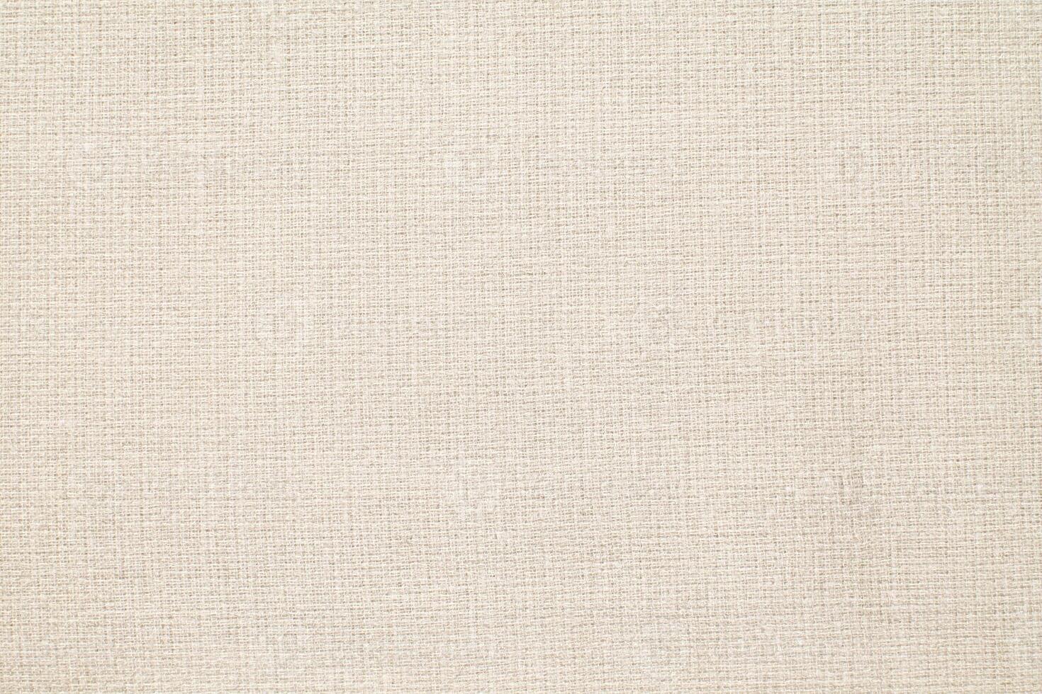 Natural Linen Material Textile Canvas Fabric Texture Background Close-up Detail of Fabric Natural Color Hemp Material Pattern Design Wallpaper. Can be Used as Background or For Graphic Design photo
