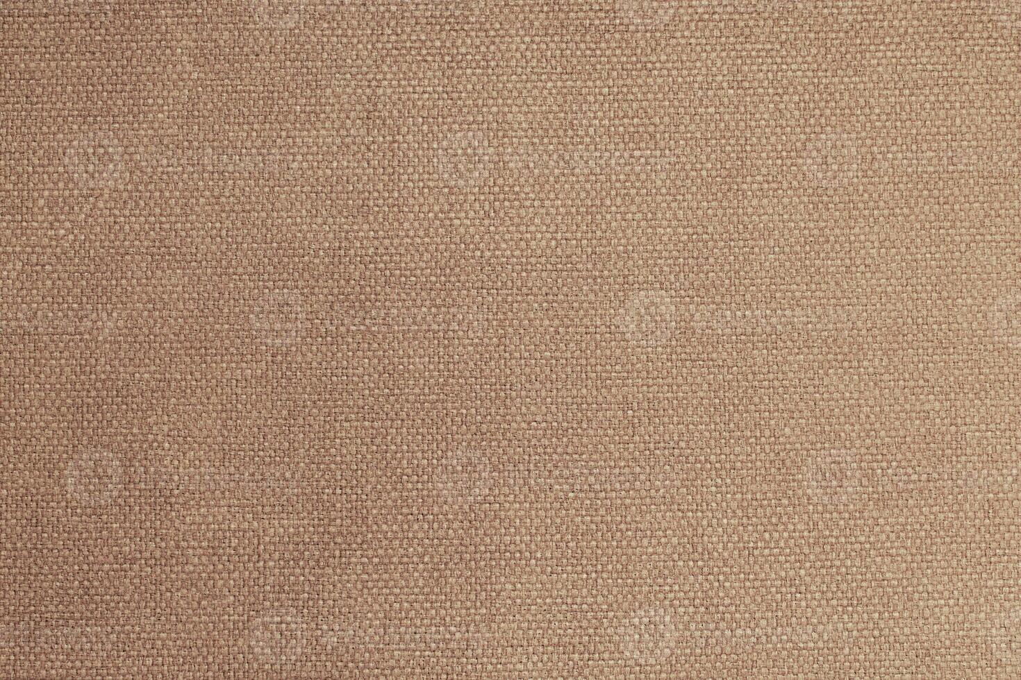 Natural Linen Material Textile Canvas Fabric Texture Background Close-up Detail of Fabric Natural Color Hemp Material Pattern Design Wallpaper. Can be Used as Background or For Graphic Design photo