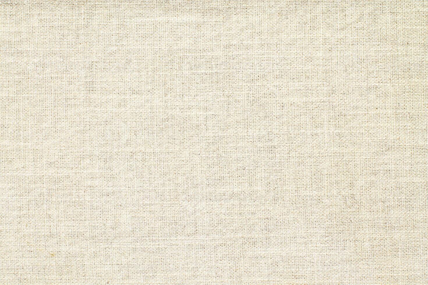 Natural Linen Material Textile Canvas Fabric Texture Background Close-up Detail of Fabric Natural Color Hemp Material Pattern Design Wallpaper. Can be Used as Background or For Graphic Design photo