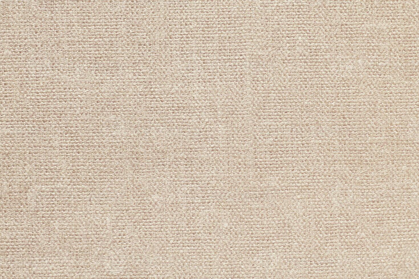 Natural Linen Material Textile Canvas Fabric Texture Background Close-up Detail of Fabric Natural Color Hemp Material Pattern Design Wallpaper. Can be Used as Background or For Graphic Design photo