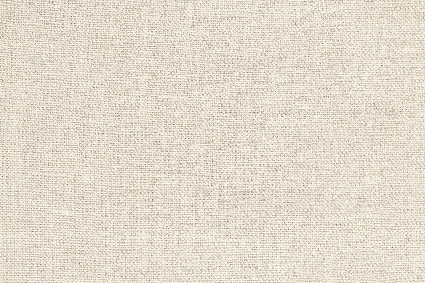 Natural Linen Material Textile Canvas Fabric Texture Background Close-up Detail of Fabric Natural Color Hemp Material Pattern Design Wallpaper. Can be Used as Background or For Graphic Design photo