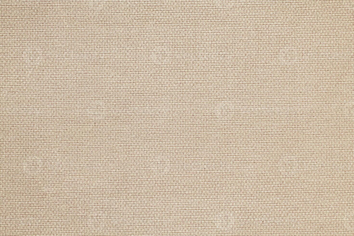 Natural Linen Material Textile Canvas Fabric Texture Background Close-up Detail of Fabric Natural Color Hemp Material Pattern Design Wallpaper. Can be Used as Background or For Graphic Design photo