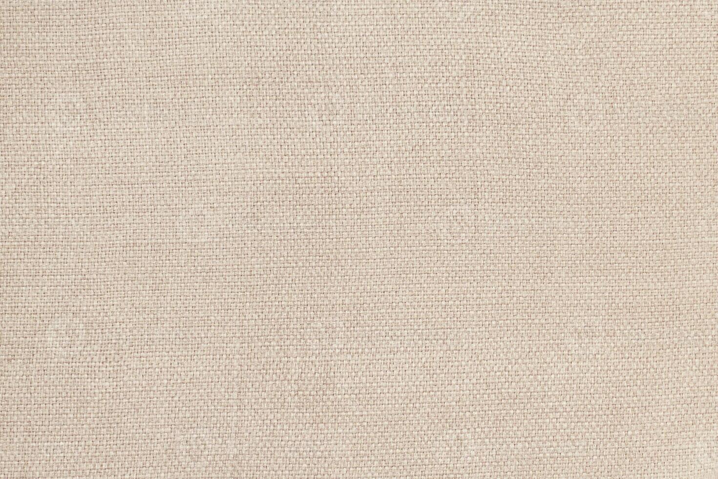 Natural Linen Material Textile Canvas Fabric Texture Background Close-up Detail of Fabric Natural Color Hemp Material Pattern Design Wallpaper. Can be Used as Background or For Graphic Design photo