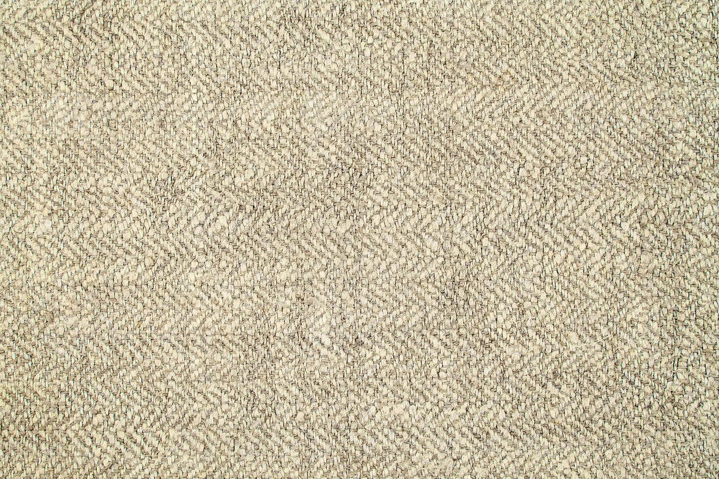 Natural Linen Material Textile Canvas Fabric Texture Background Close-up Detail of Fabric Natural Color Hemp Material Pattern Design Wallpaper. Can be Used as Background or For Graphic Design photo