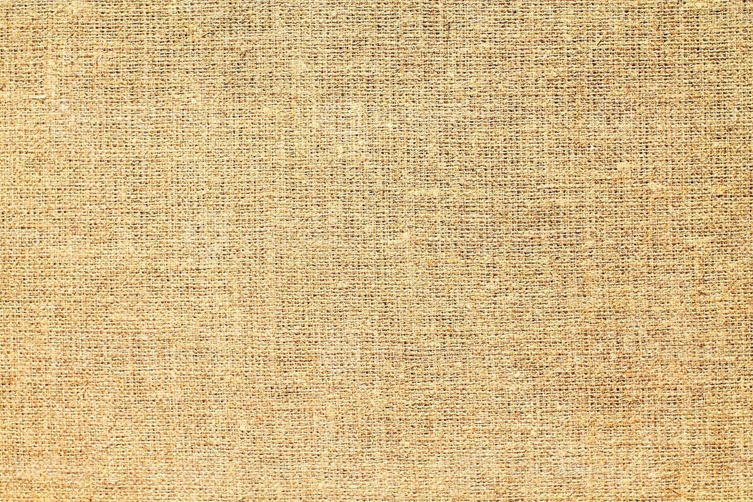 Natural Linen Material Textile Canvas Fabric Texture Background Close-up Detail of Fabric Natural Color Hemp Material Pattern Design Wallpaper. Can be Used as Background or For Graphic Design photo