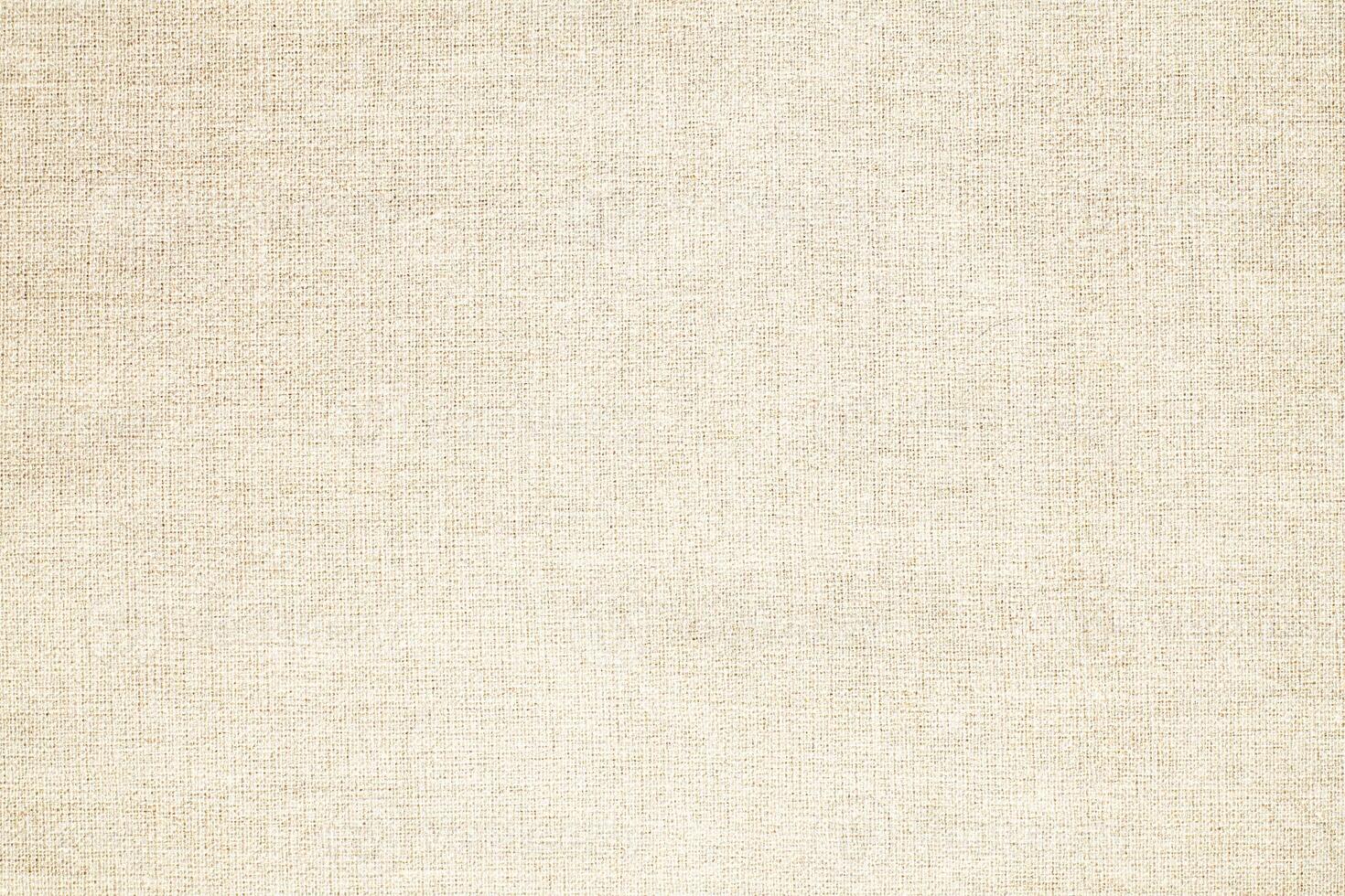 Natural Linen Material Textile Canvas Fabric Texture Background Close-up Detail of Fabric Natural Color Hemp Material Pattern Design Wallpaper. Can be Used as Background or For Graphic Design photo