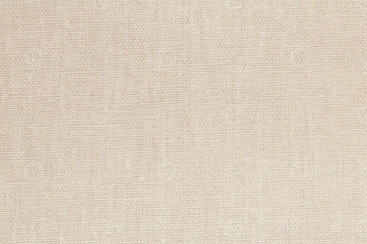 Natural Linen Material Textile Canvas Fabric Texture Background Close-up Detail of Fabric Natural Color Hemp Material Pattern Design Wallpaper. Can be Used as Background or For Graphic Design photo
