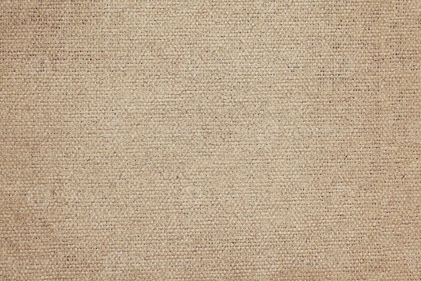 Natural Linen Material Textile Canvas Fabric Texture Background Close-up Detail of Fabric Natural Color Hemp Material Pattern Design Wallpaper. Can be Used as Background or For Graphic Design photo