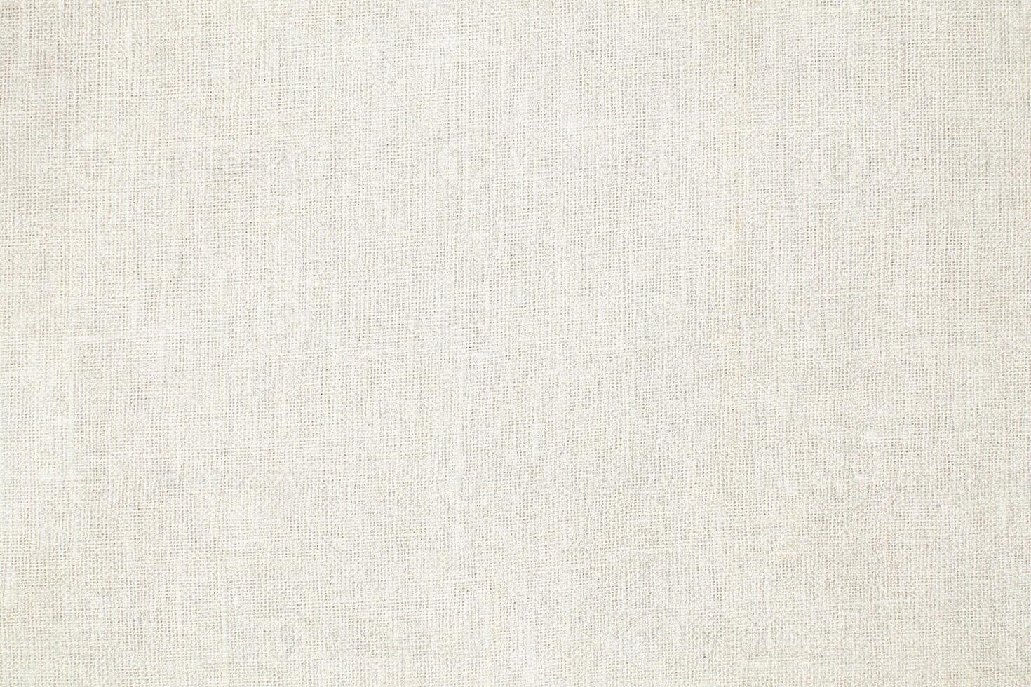 Natural Linen Material Textile Canvas Fabric Texture Background Close-up Detail of Fabric Natural Color Hemp Material Pattern Design Wallpaper. Can be Used as Background or For Graphic Design photo