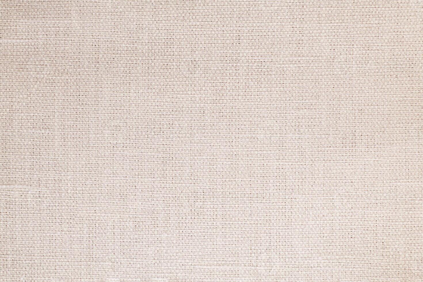 Natural Linen Material Textile Canvas Fabric Texture Background Close-up Detail of Fabric Natural Color Hemp Material Pattern Design Wallpaper. Can be Used as Background or For Graphic Design photo