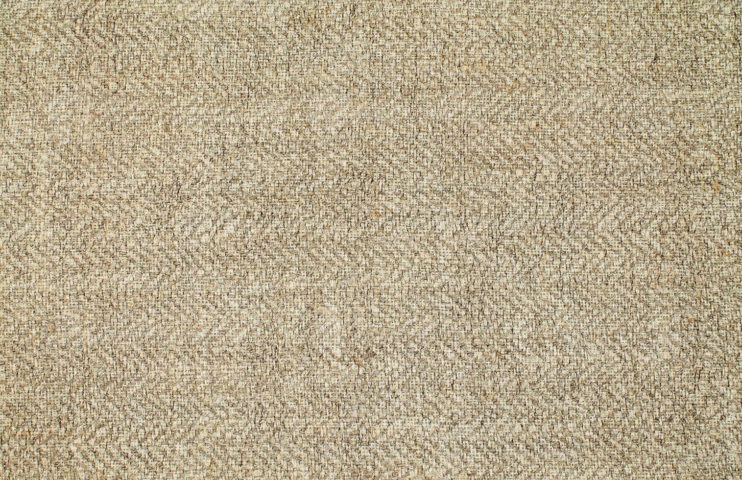 Natural Linen Material Textile Canvas Fabric Texture Background Close-up Detail of Fabric Natural Color Hemp Material Pattern Design Wallpaper. Can be Used as Background or For Graphic Design photo