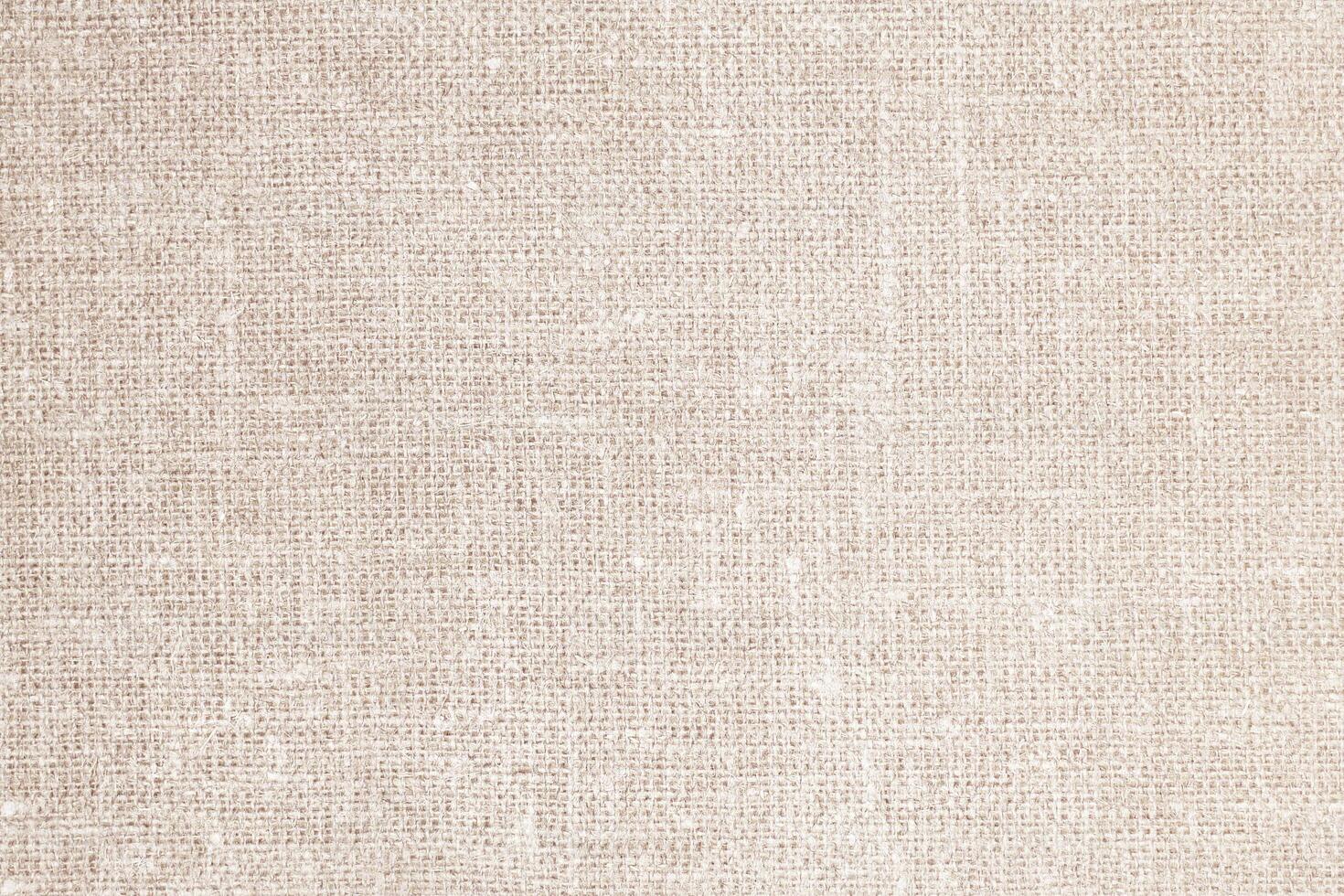 Natural Linen Material Textile Canvas Fabric Texture Background Close-up Detail of Fabric Natural Color Hemp Material Pattern Design Wallpaper. Can be Used as Background or For Graphic Design photo