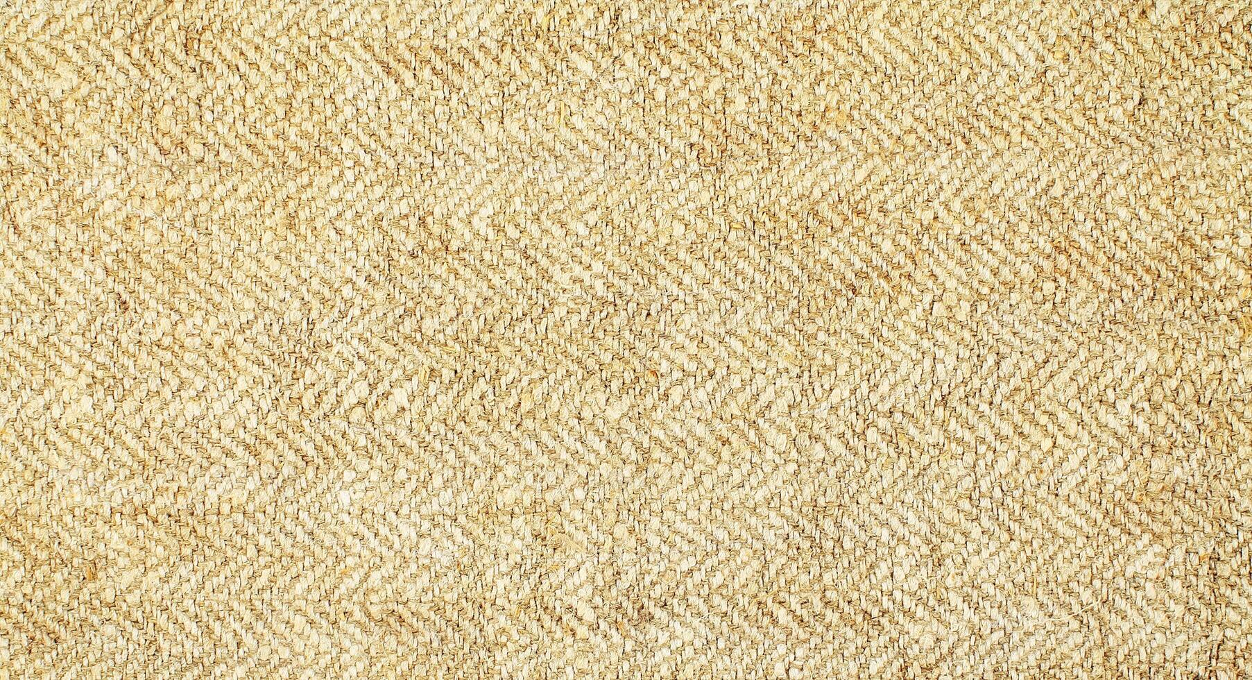 Natural Linen Material Textile Canvas Fabric Texture Background Close-up Detail of Fabric Natural Color Hemp Material Pattern Design Wallpaper. Can be Used as Background or For Graphic Design photo