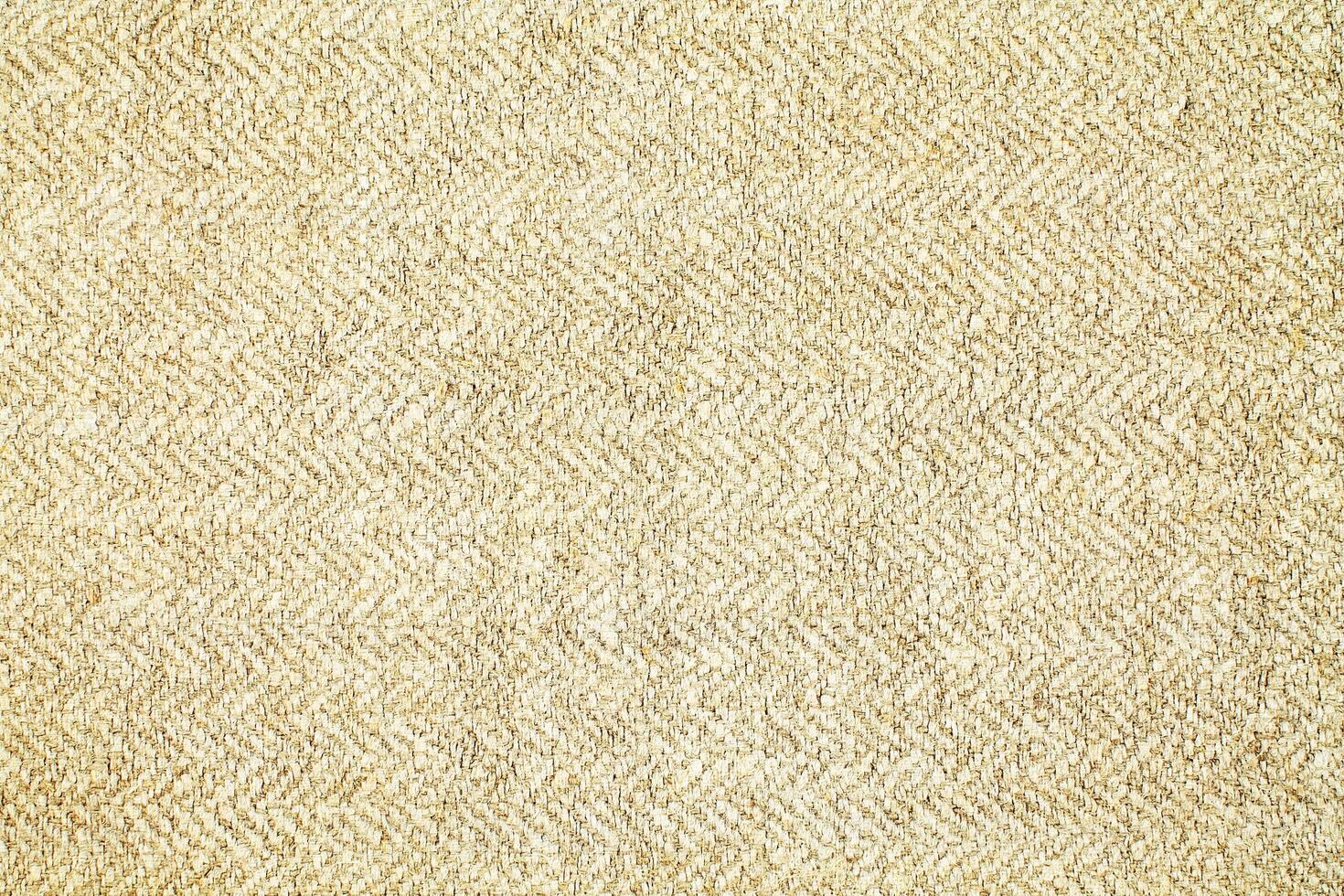 Natural Linen Material Textile Canvas Fabric Texture Background Close-up Detail of Fabric Natural Color Hemp Material Pattern Design Wallpaper. Can be Used as Background or For Graphic Design photo
