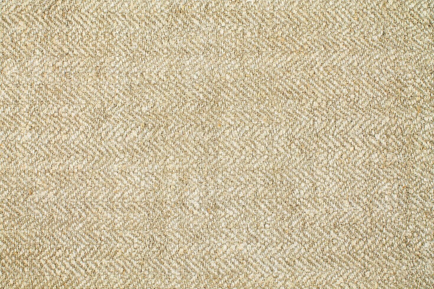 Natural Linen Material Textile Canvas Fabric Texture Background Close-up Detail of Fabric Natural Color Hemp Material Pattern Design Wallpaper. Can be Used as Background or For Graphic Design photo