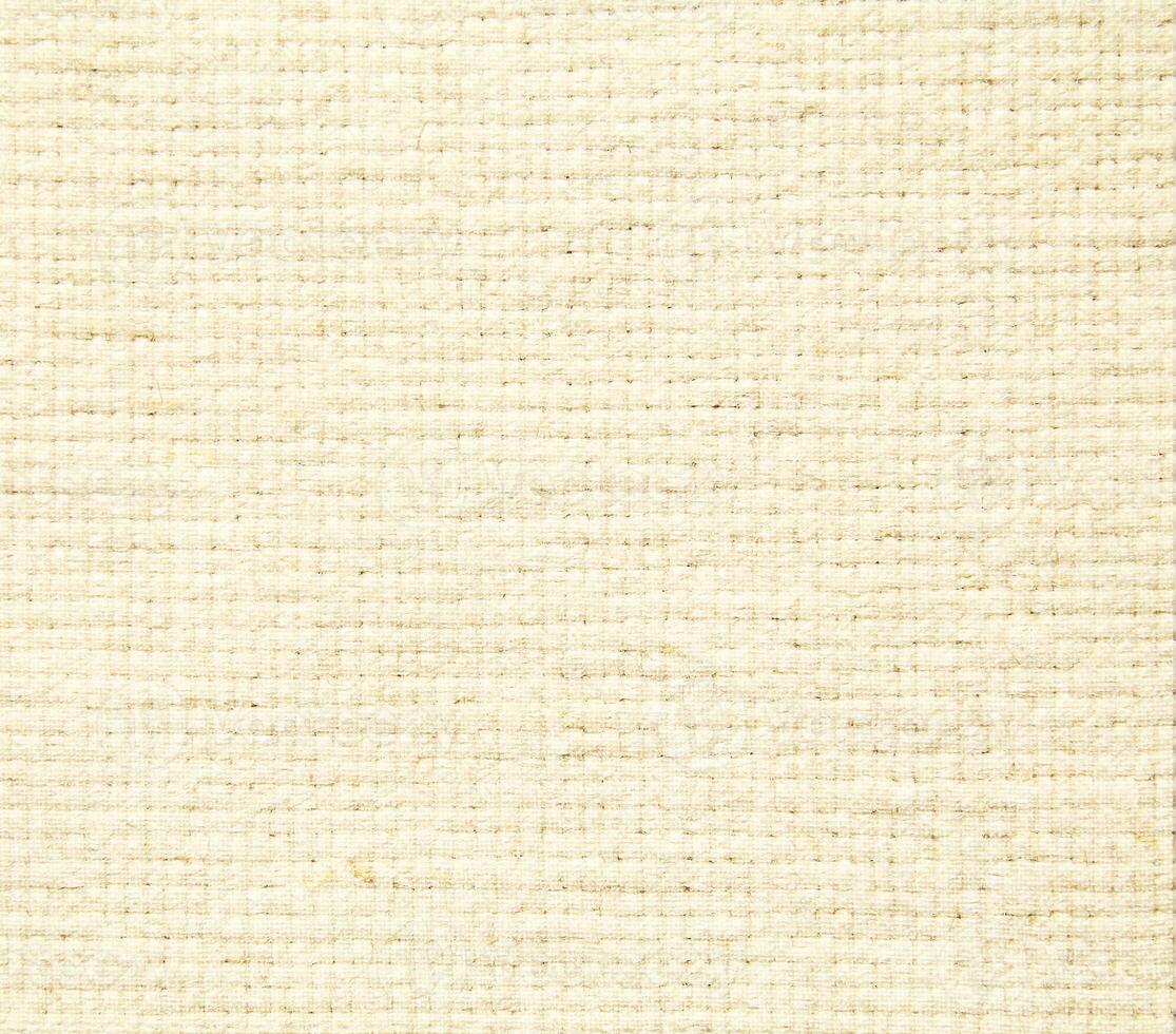 Natural Linen Material Textile Canvas Fabric Texture Background Close-up Detail of Fabric Natural Color Hemp Material Pattern Design Wallpaper. Can be Used as Background or For Graphic Design photo