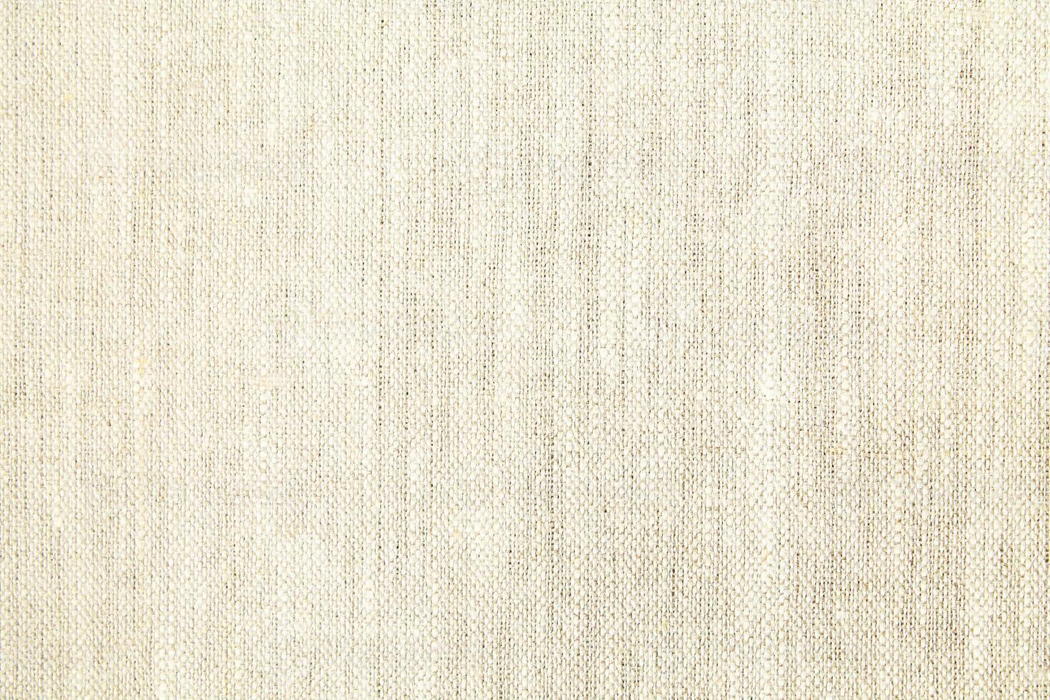 Natural Linen Material Textile Canvas Fabric Texture Background Close-up Detail of Fabric Natural Color Hemp Material Pattern Design Wallpaper. Can be Used as Background or For Graphic Design photo