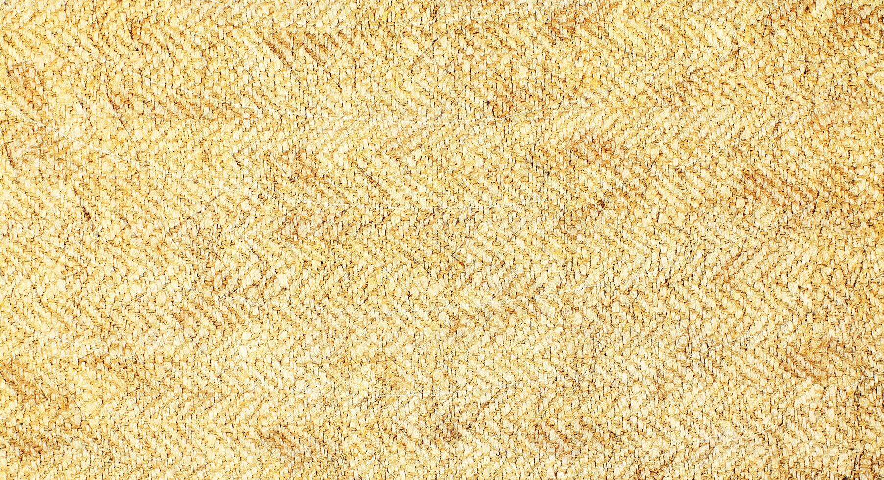 Natural Linen Material Textile Canvas Fabric Texture Background Close-up Detail of Fabric Natural Color Hemp Material Pattern Design Wallpaper. Can be Used as Background or For Graphic Design photo