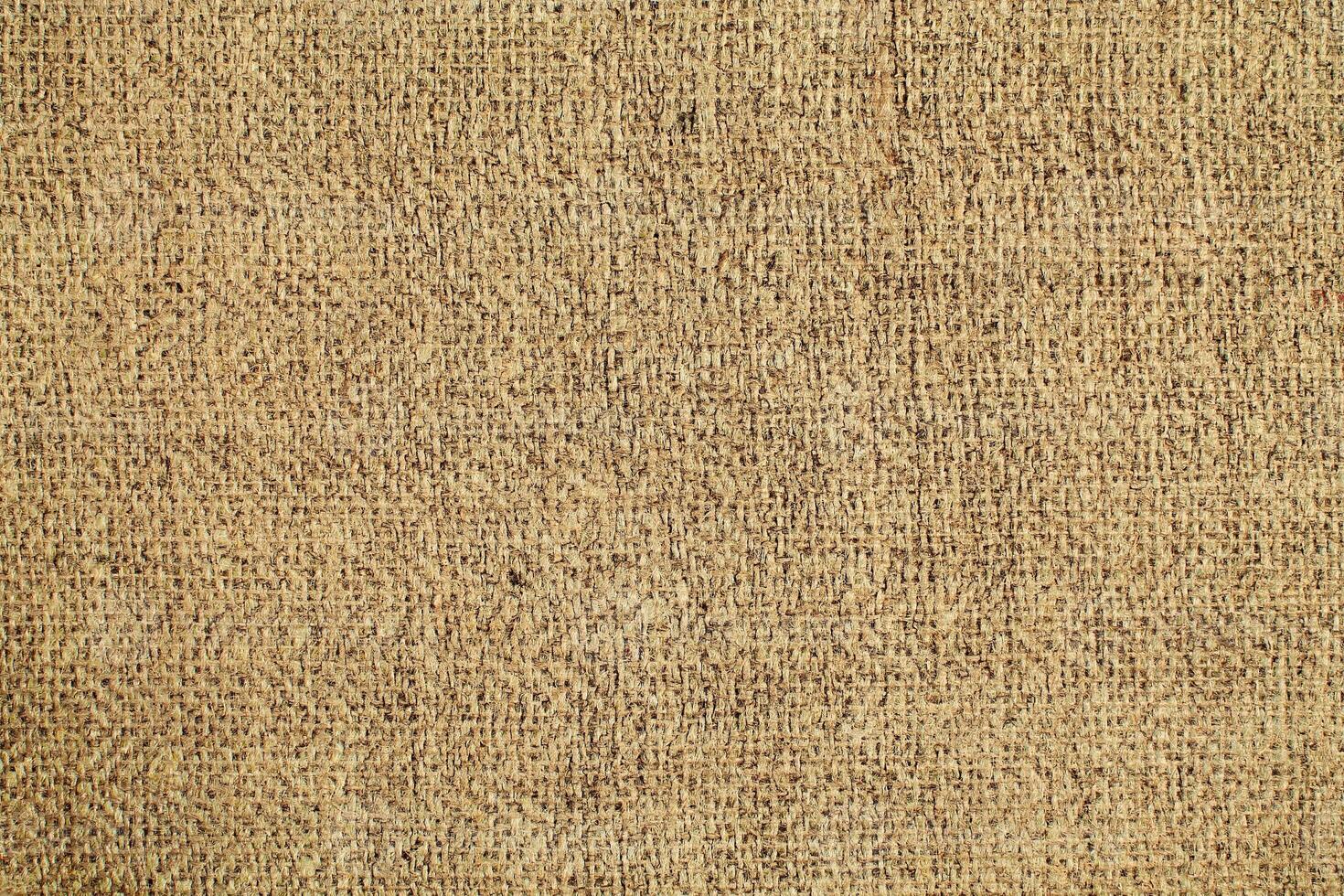 Natural Linen Material Textile Canvas Fabric Texture Background Close-up Detail of Fabric Natural Color Hemp Material Pattern Design Wallpaper. Can be Used as Background or For Graphic Design photo