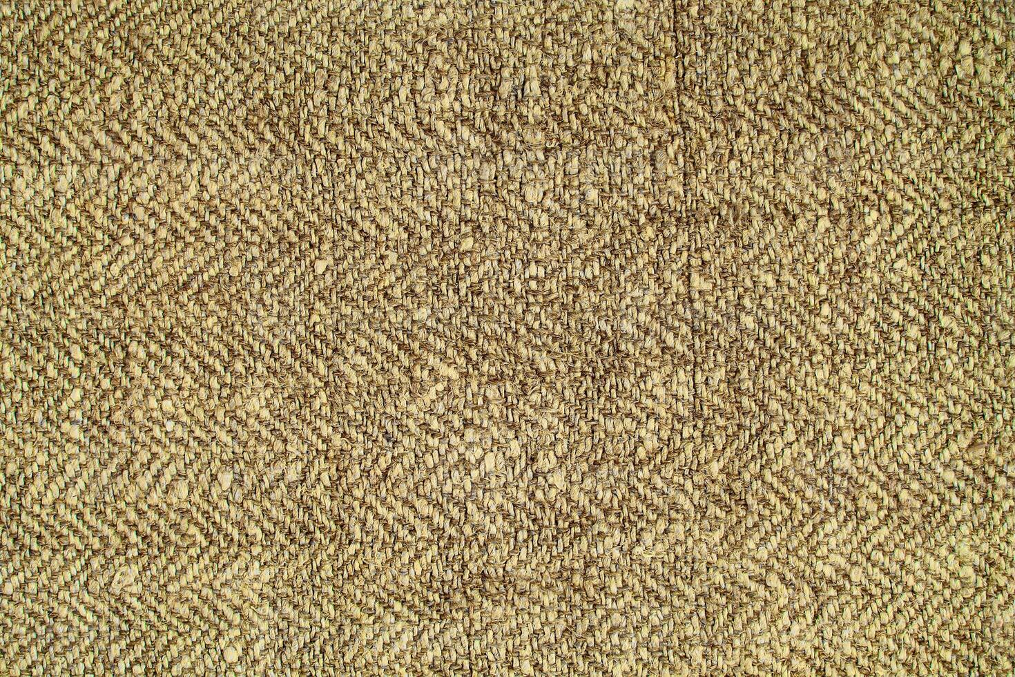 Natural Linen Material Textile Canvas Fabric Texture Background Close-up Detail of Fabric Natural Color Hemp Material Pattern Design Wallpaper. Can be Used as Background or For Graphic Design photo