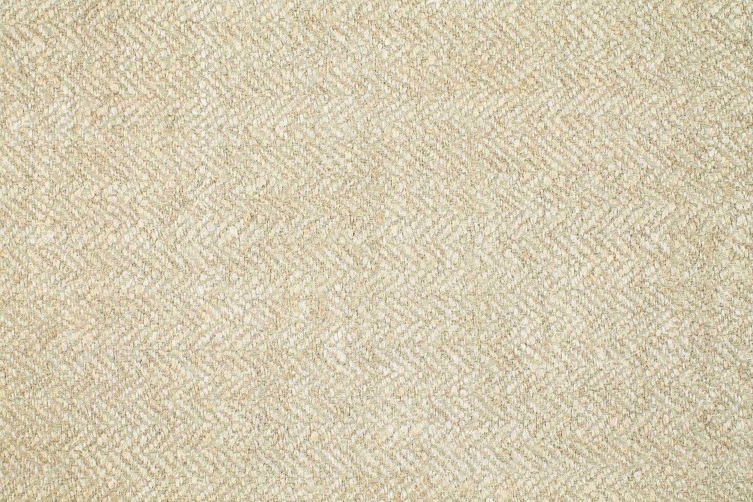 Natural Linen Material Textile Canvas Fabric Texture Background Close-up Detail of Fabric Natural Color Hemp Material Pattern Design Wallpaper. Can be Used as Background or For Graphic Design photo