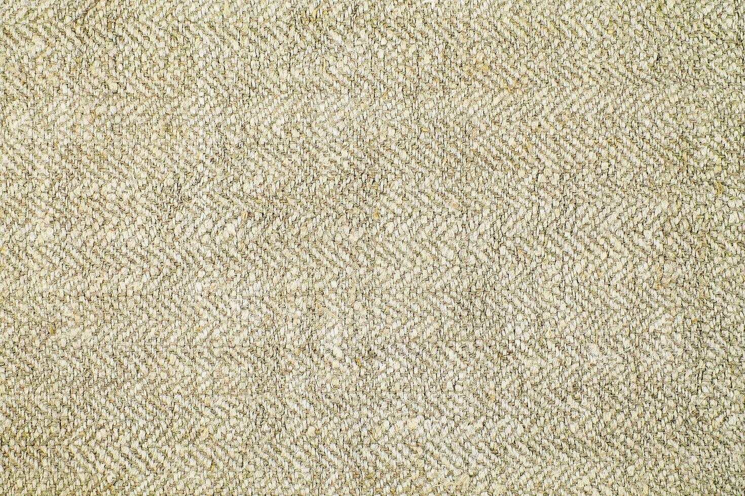 Natural Linen Material Textile Canvas Fabric Texture Background Close-up Detail of Fabric Natural Color Hemp Material Pattern Design Wallpaper. Can be Used as Background or For Graphic Design photo