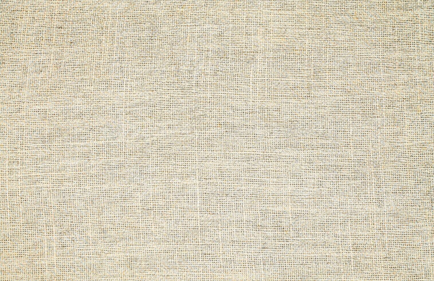 Natural Linen Material Textile Canvas Fabric Texture Background Close-up Detail of Fabric Natural Color Hemp Material Pattern Design Wallpaper. Can be Used as Background or For Graphic Design photo