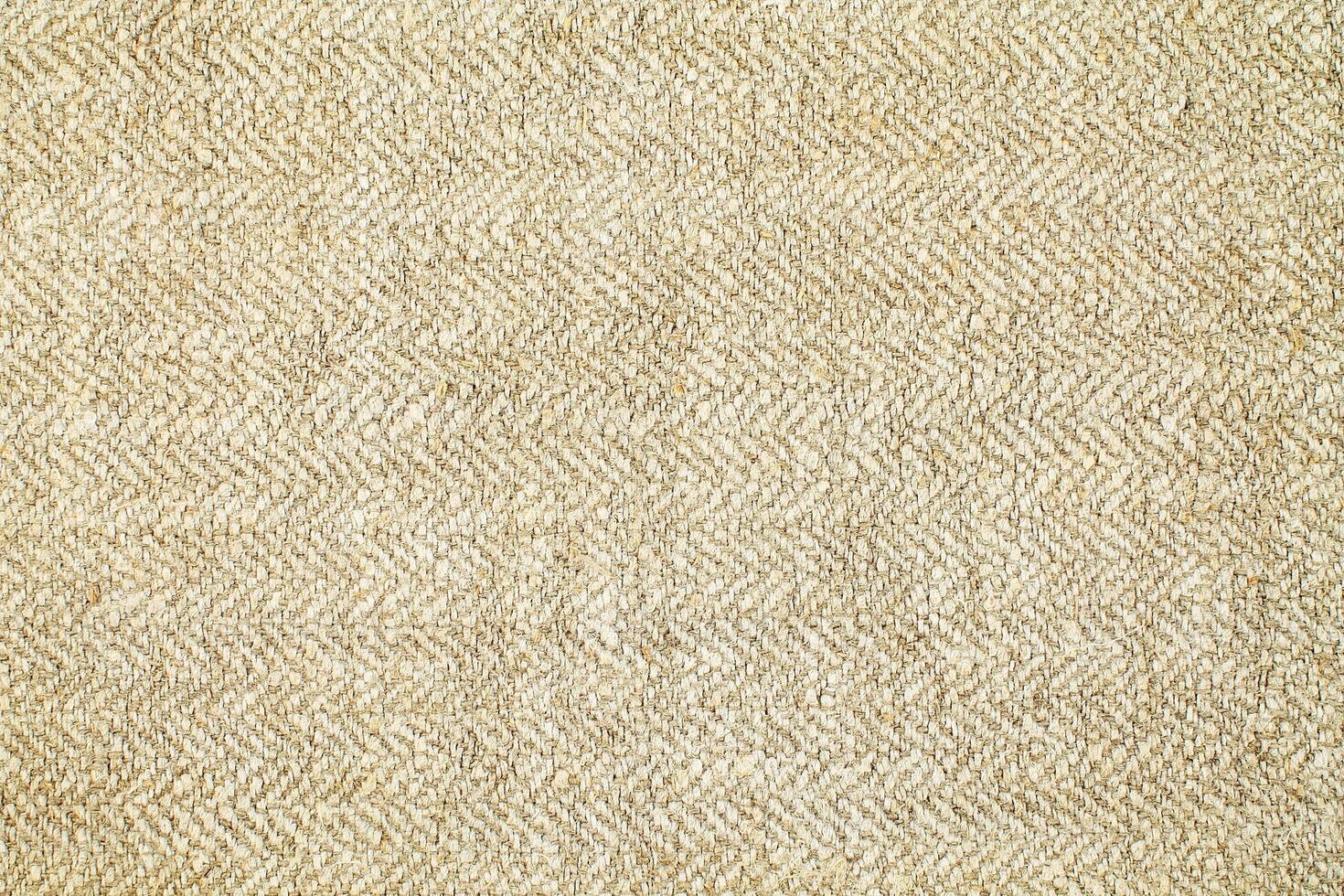 Natural Linen Material Textile Canvas Fabric Texture Background Close-up Detail of Fabric Natural Color Hemp Material Pattern Design Wallpaper. Can be Used as Background or For Graphic Design photo