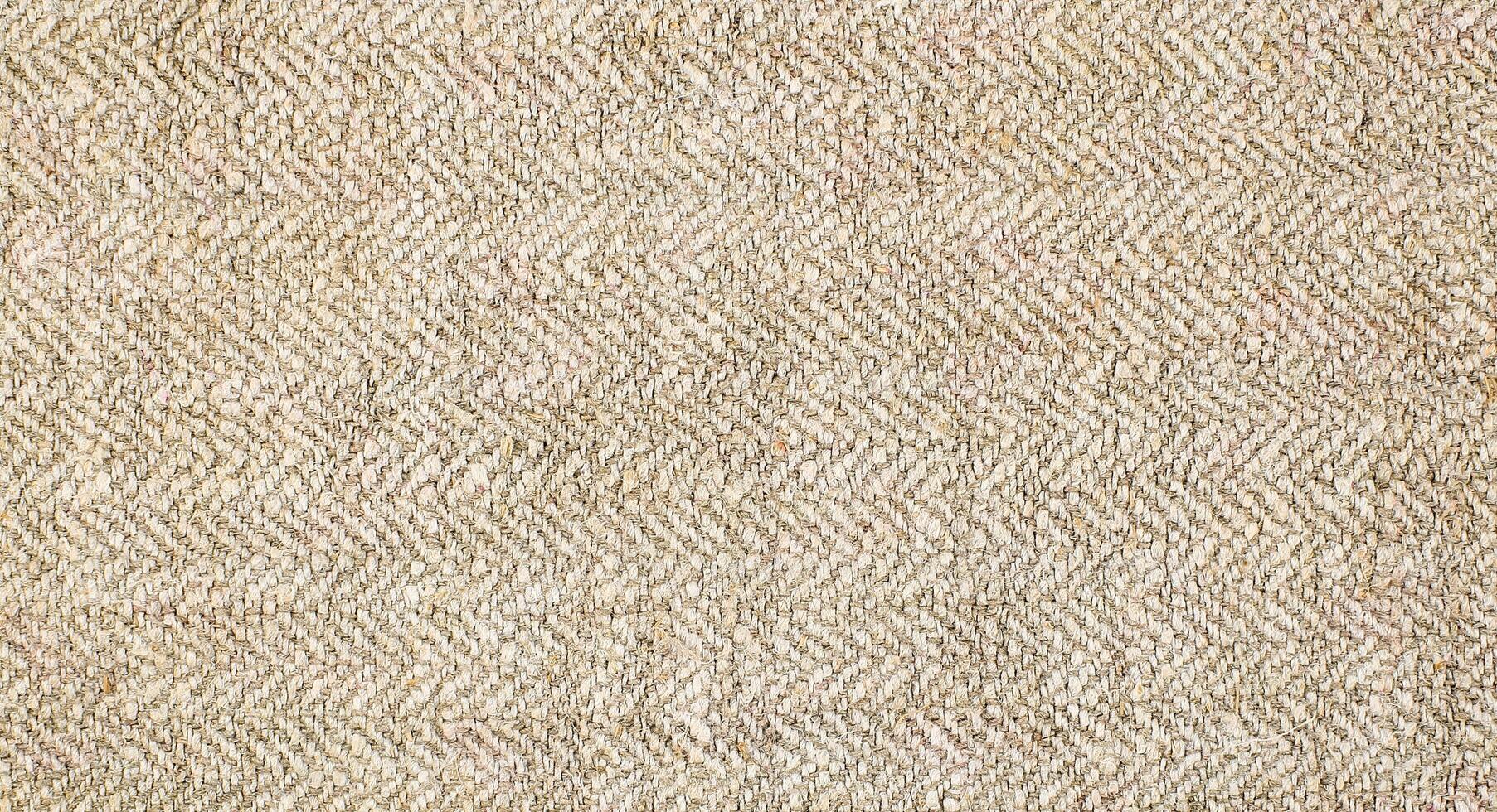 Natural Linen Material Textile Canvas Fabric Texture Background Close-up Detail of Fabric Natural Color Hemp Material Pattern Design Wallpaper. Can be Used as Background or For Graphic Design photo