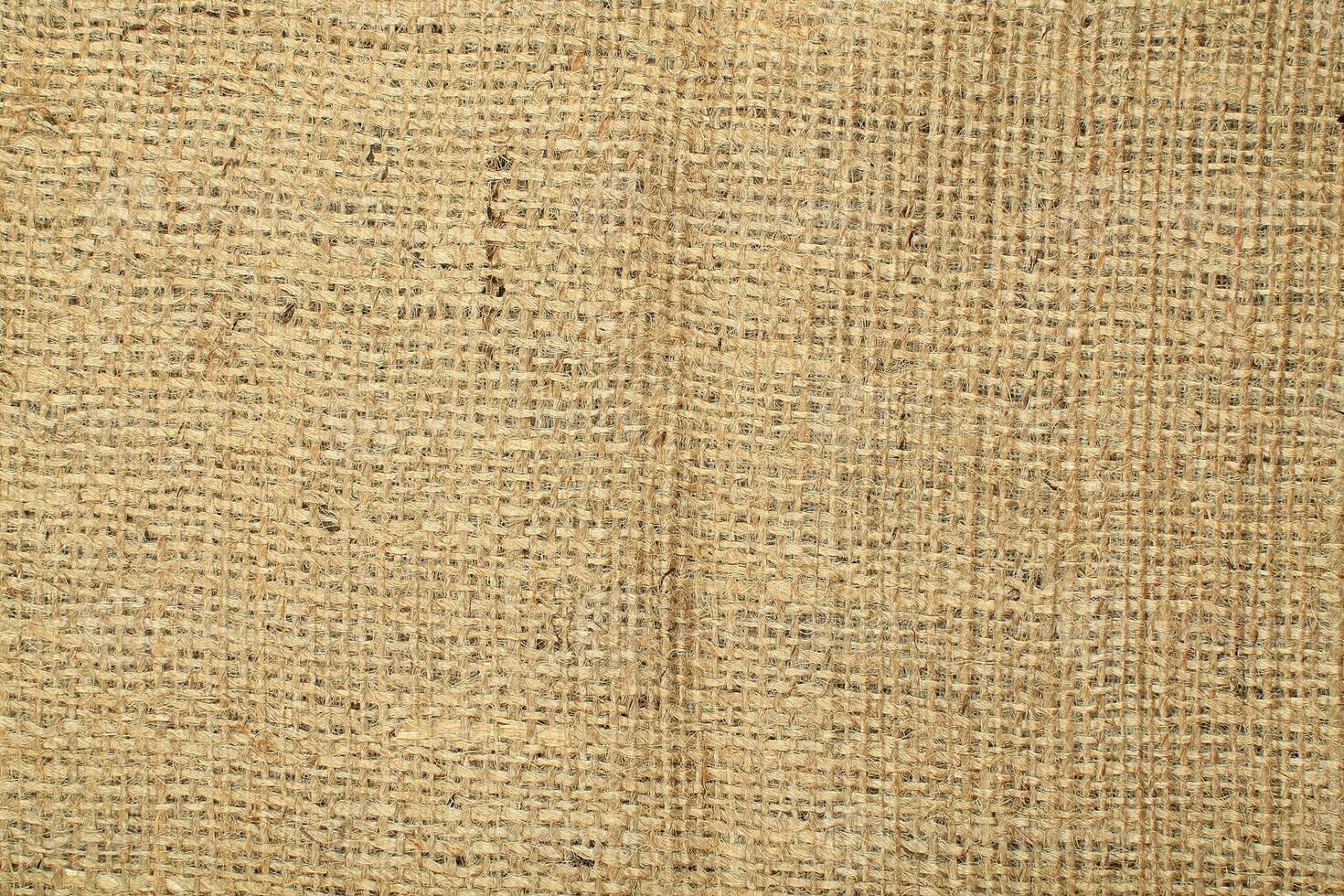 Natural Linen Material Textile Canvas Fabric Texture Background Close-up Detail of Fabric Natural Color Hemp Material Pattern Design Wallpaper. Can be Used as Background or For Graphic Design photo