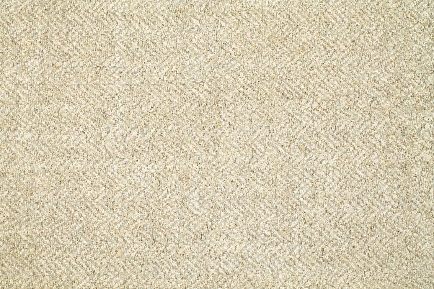 Natural Linen Material Textile Canvas Fabric Texture Background Close-up Detail of Fabric Natural Color Hemp Material Pattern Design Wallpaper. Can be Used as Background or For Graphic Design photo