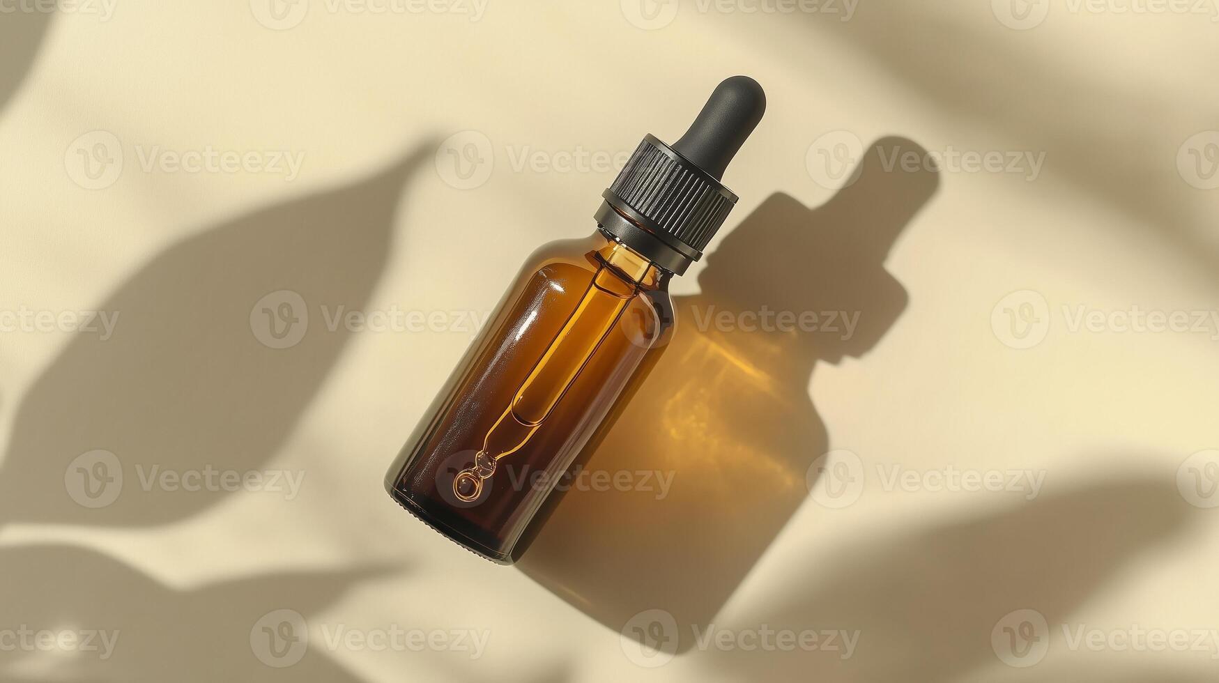 A brown glass bottle with an amber dropper for skin care on beige background. photo