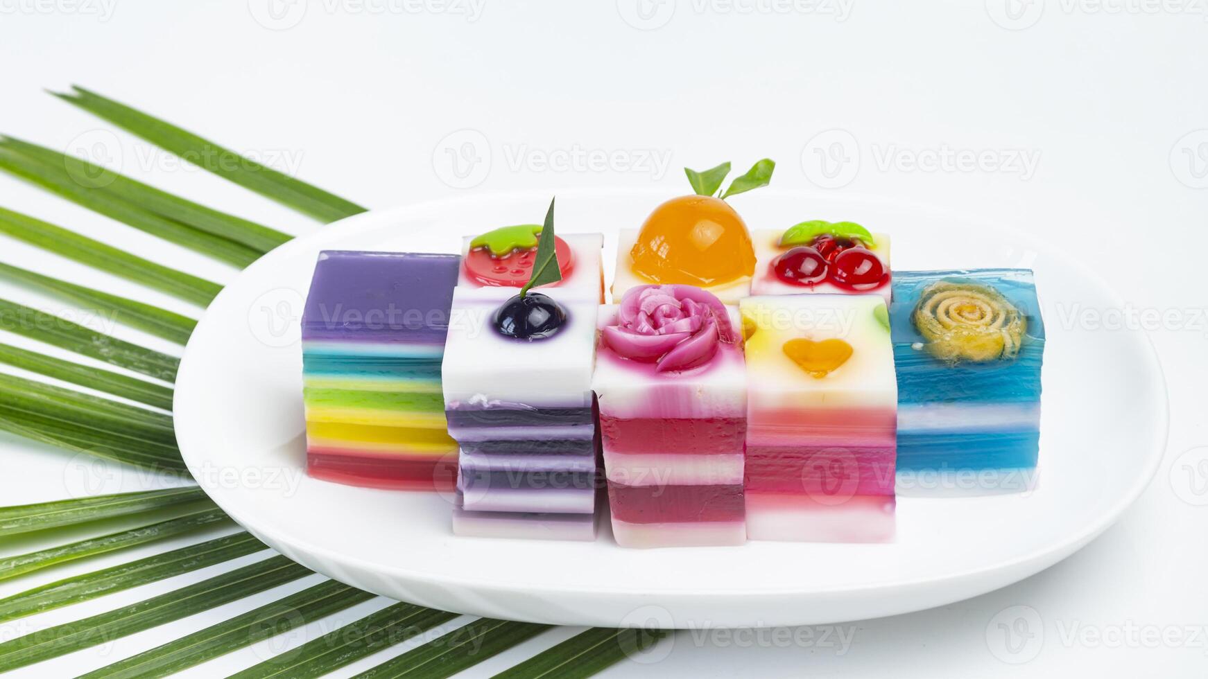several different colored jelly on white plate photo