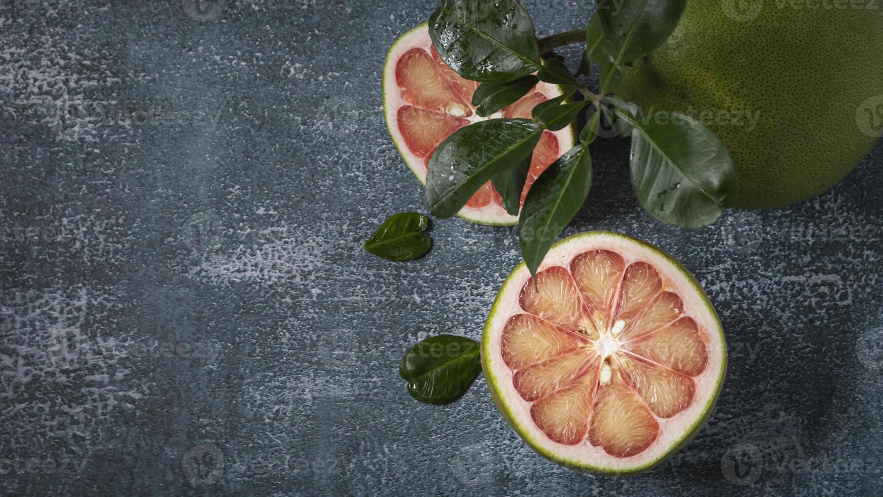pomelo on a dark background photo