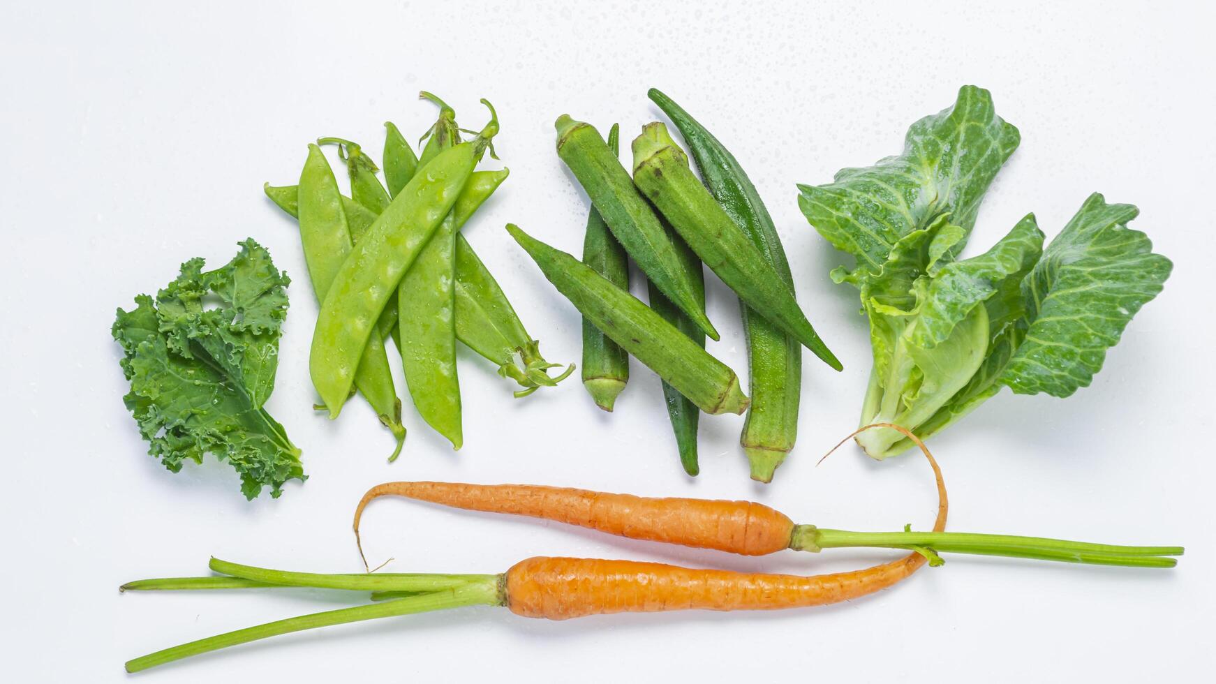 a bunch of vegetables on a white surface photo
