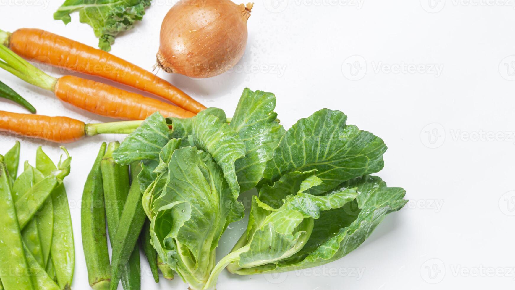 a bunch of vegetables including carrots, celery, and onions photo