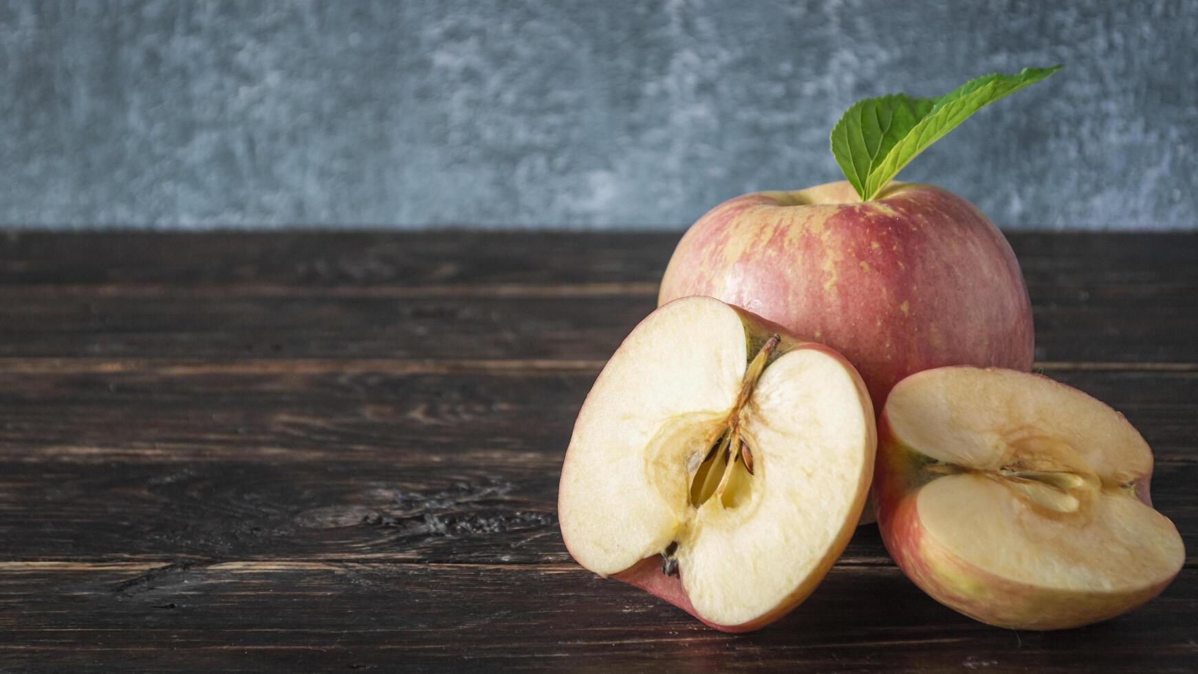 fresh apples on wooden table with copy space photo