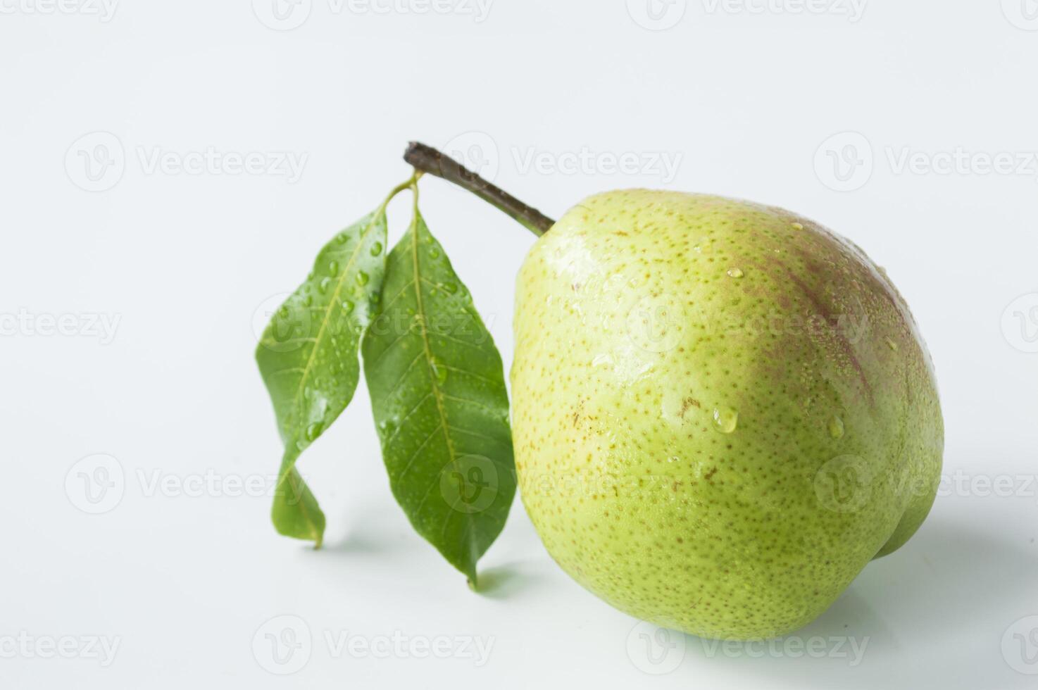 a pear with a leaf on it is on a white background photo