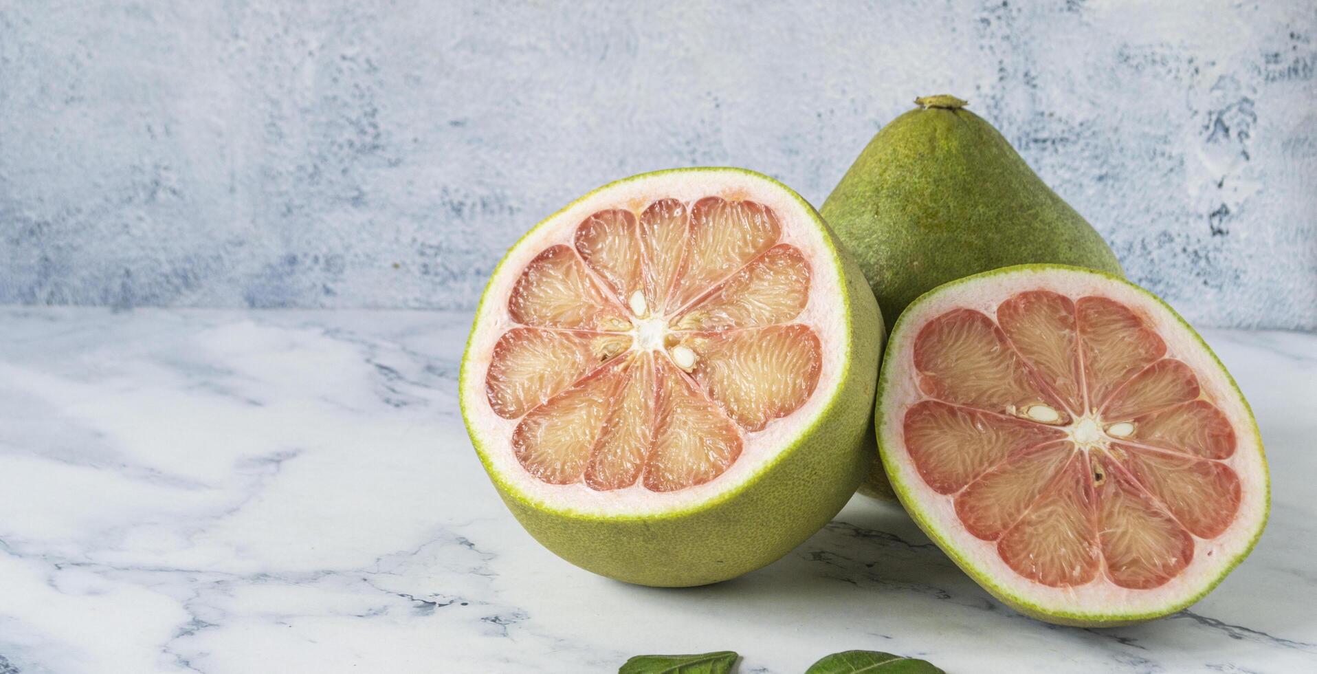 pomelo and a half cut in half photo