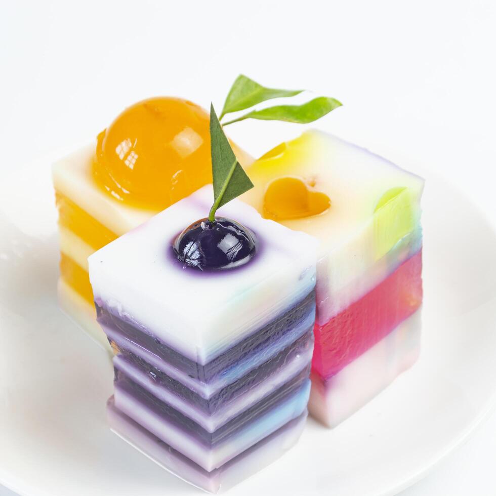 a white plate with three different colored jelly on it photo