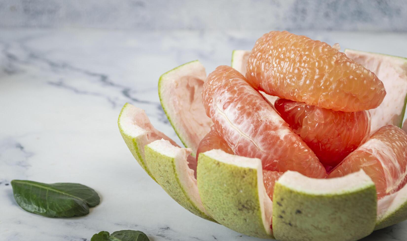 a grapefruit is cut in half photo
