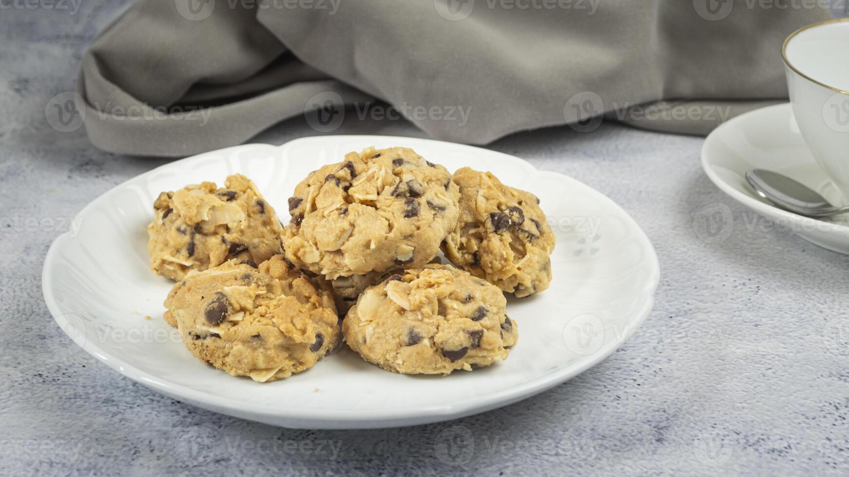 a plate of cookies and a cup of coffee photo
