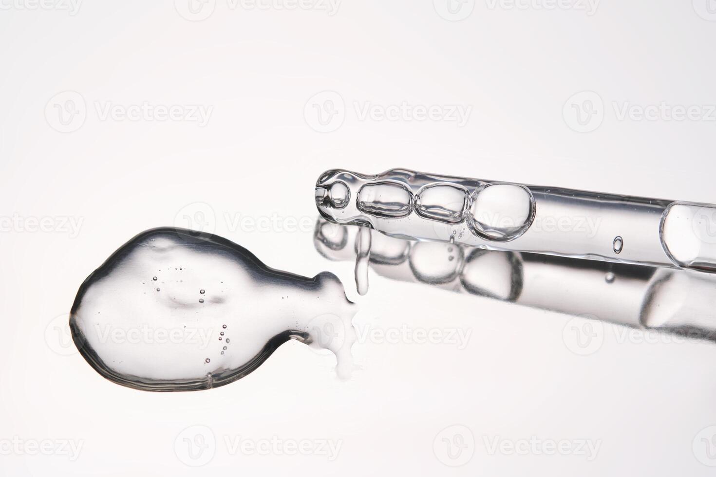Pipette with cosmetic gel or serum close-up. photo