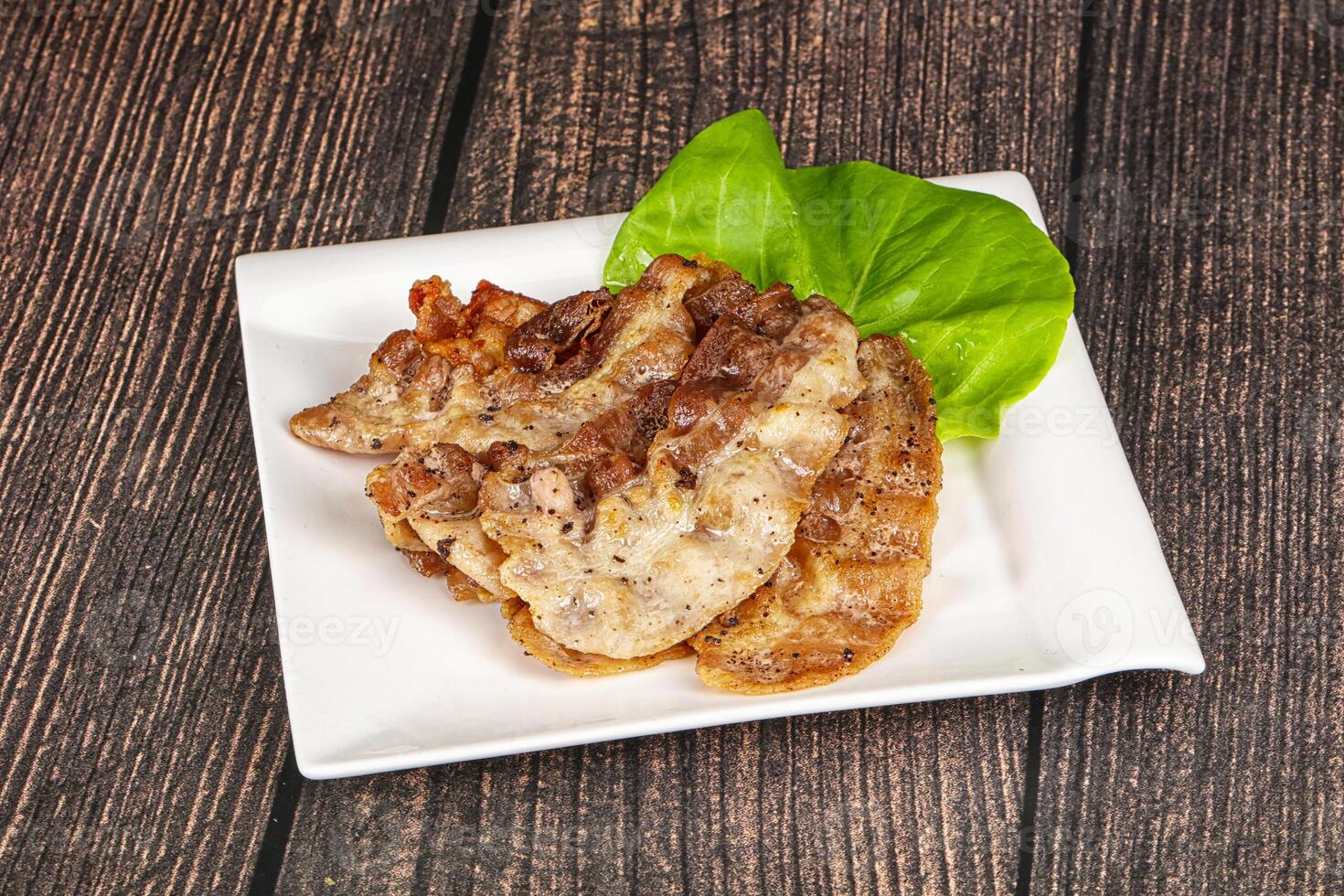 Roasted sliced pork fat bacon photo