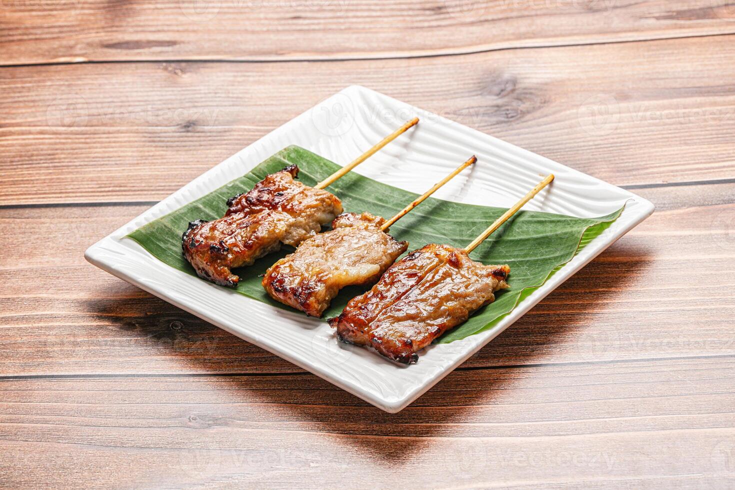Thai cuisine - grilled pork skewer photo