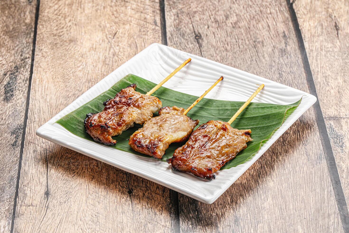 Thai cuisine - grilled pork skewer photo