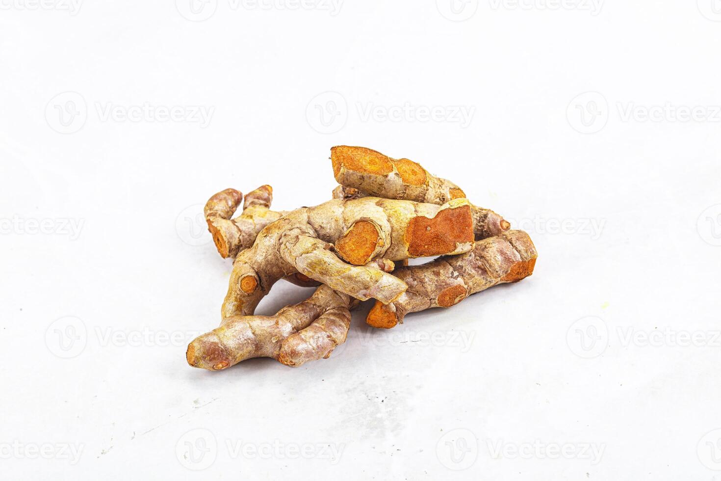 Fresh young Tumeric root heap photo