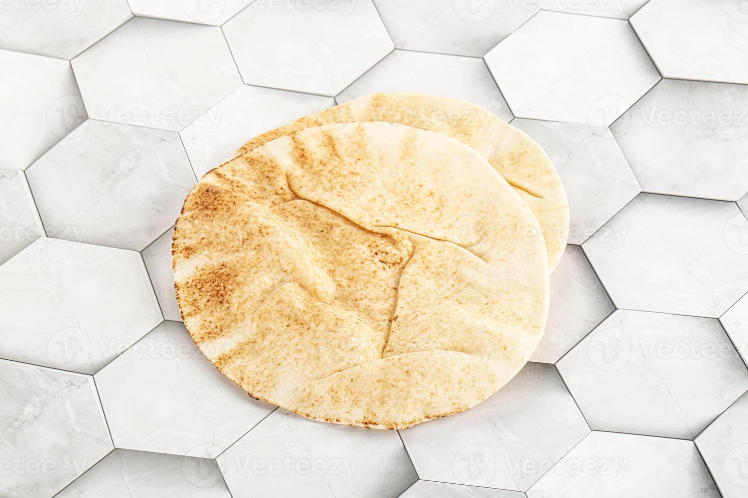 Traditional eastern round pita bread photo